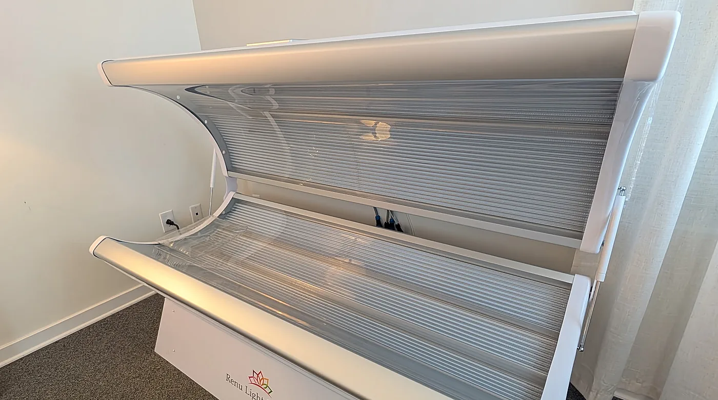 The white Renu Light Pod full-body red light therapy bed at RedLight Freedom