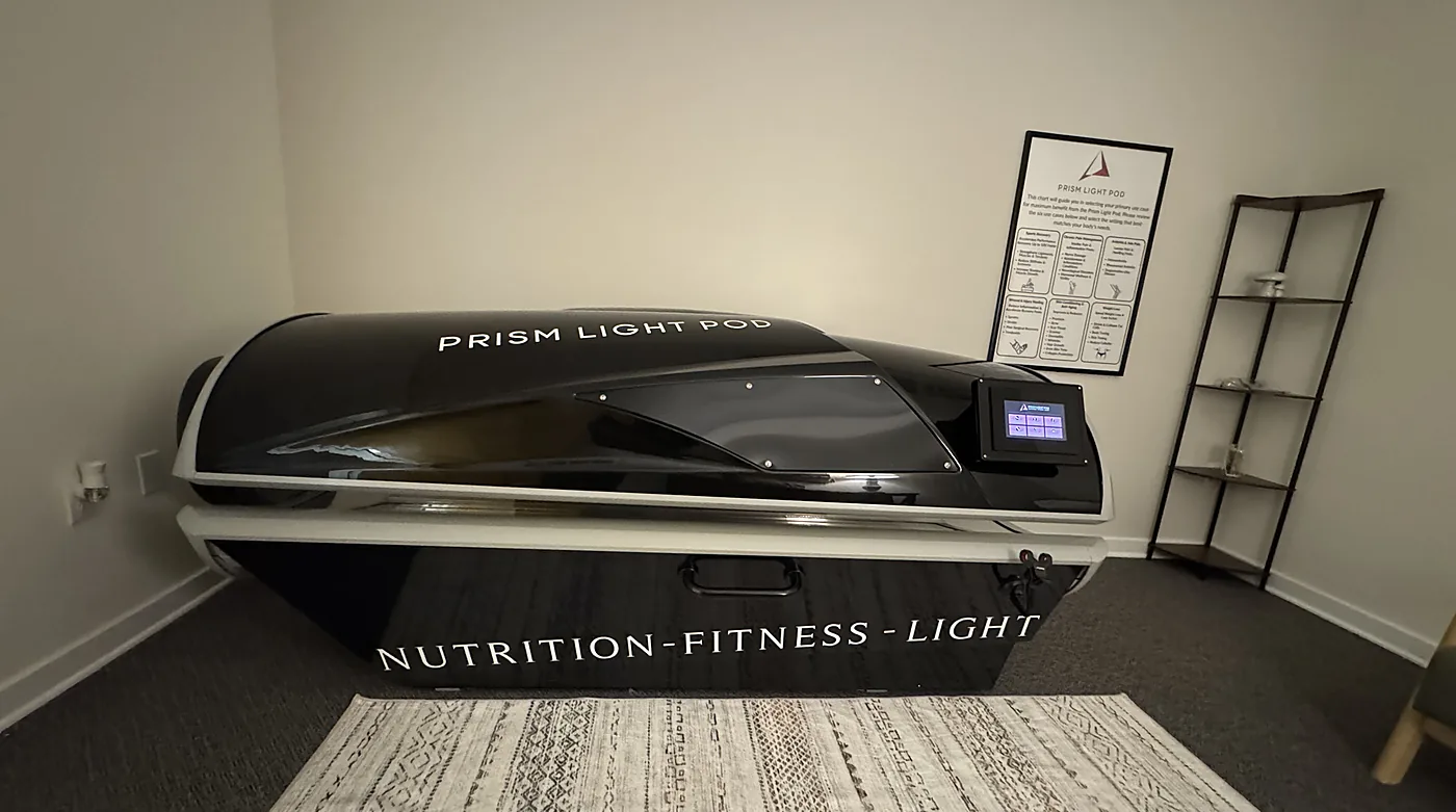 The black Prism Light Pod whole-body red light therapy bed at RedLight Freedom